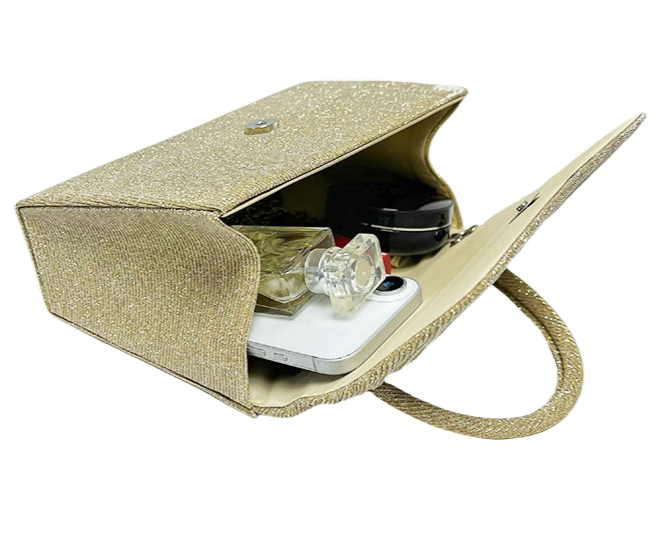 Gold glittery pouch with a phone, perfume, makeup and earbuds inside on a white background