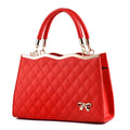 Red quilted handbag with a bow detail on a white background