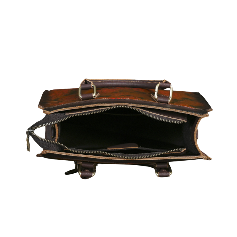 Brown leather bag with gold accents on a white background