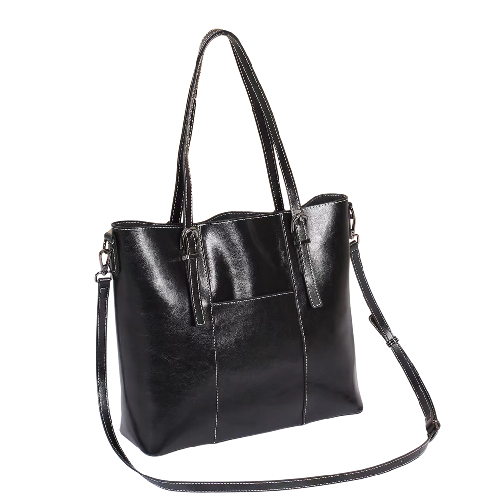 Black leather tote bag with shoulder strap on a white background