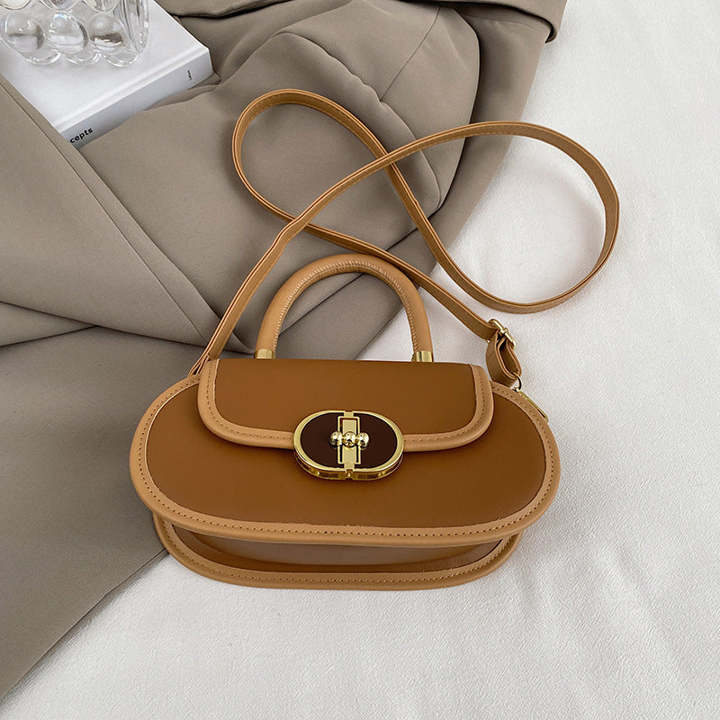 retro top handle bag laying down