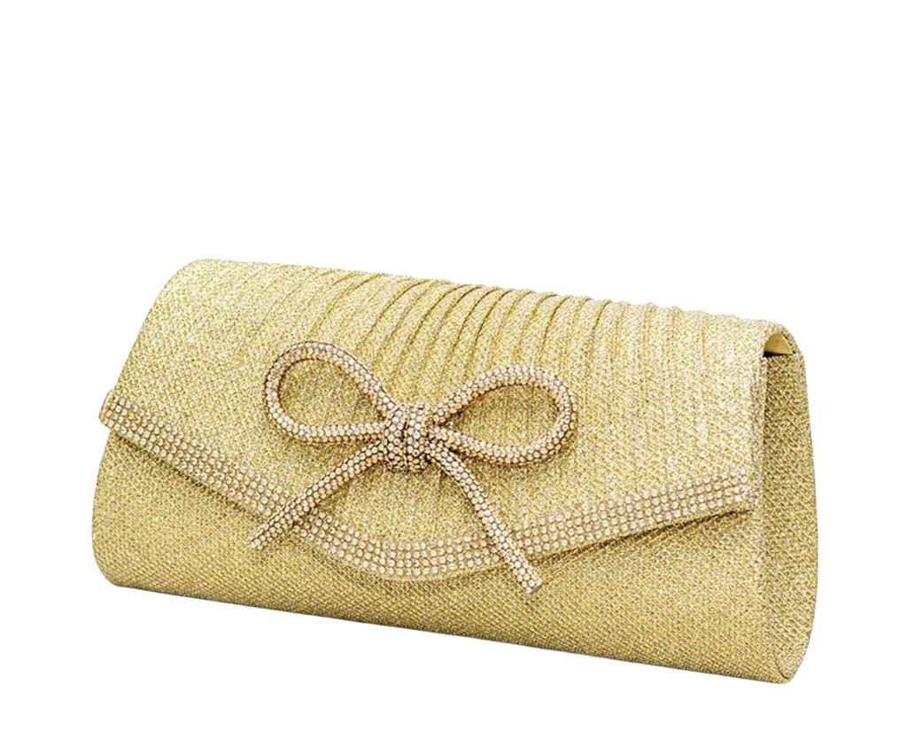 Gold clutch bag with a decorative bow on a white background