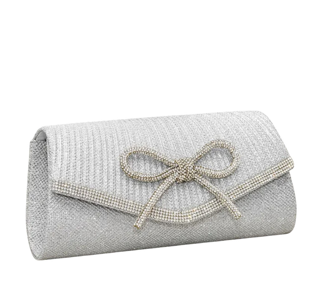 Silver clutch bag with a bow on a white background