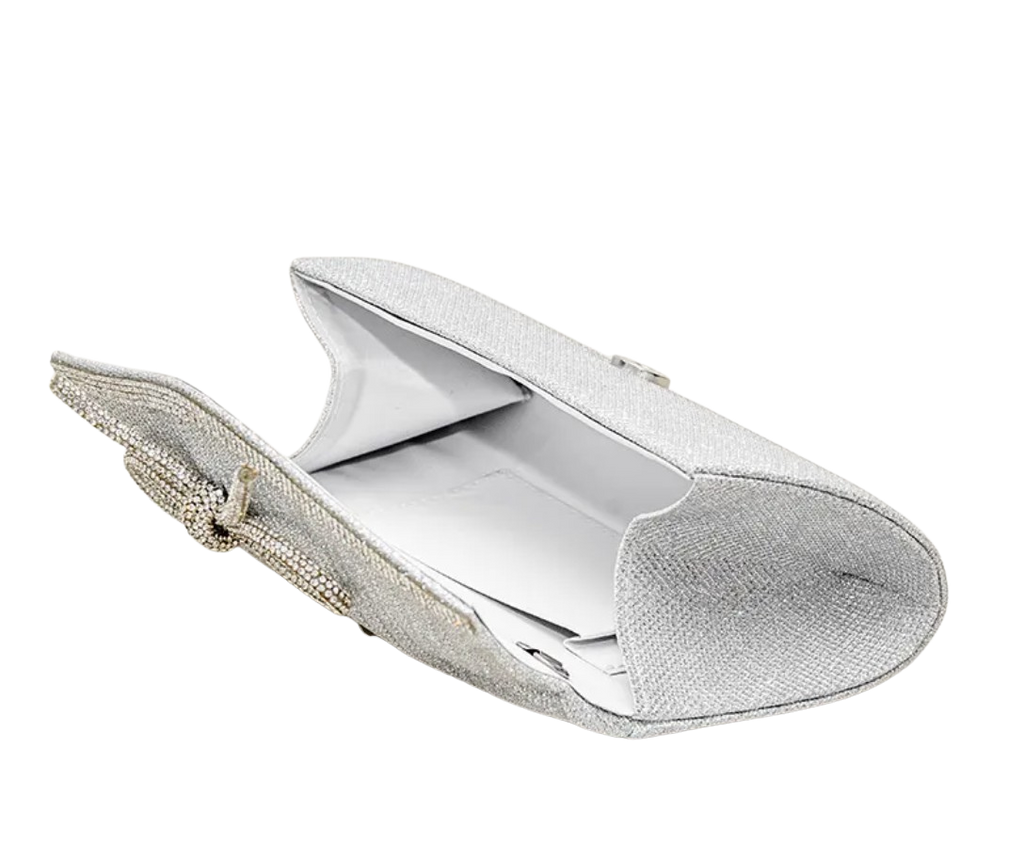 Silver clutch bag with textured surface on a white background opened up to see what can fit