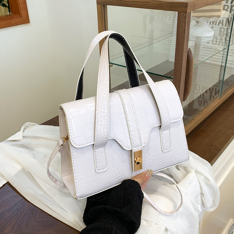 White handbag held by a woman being admired